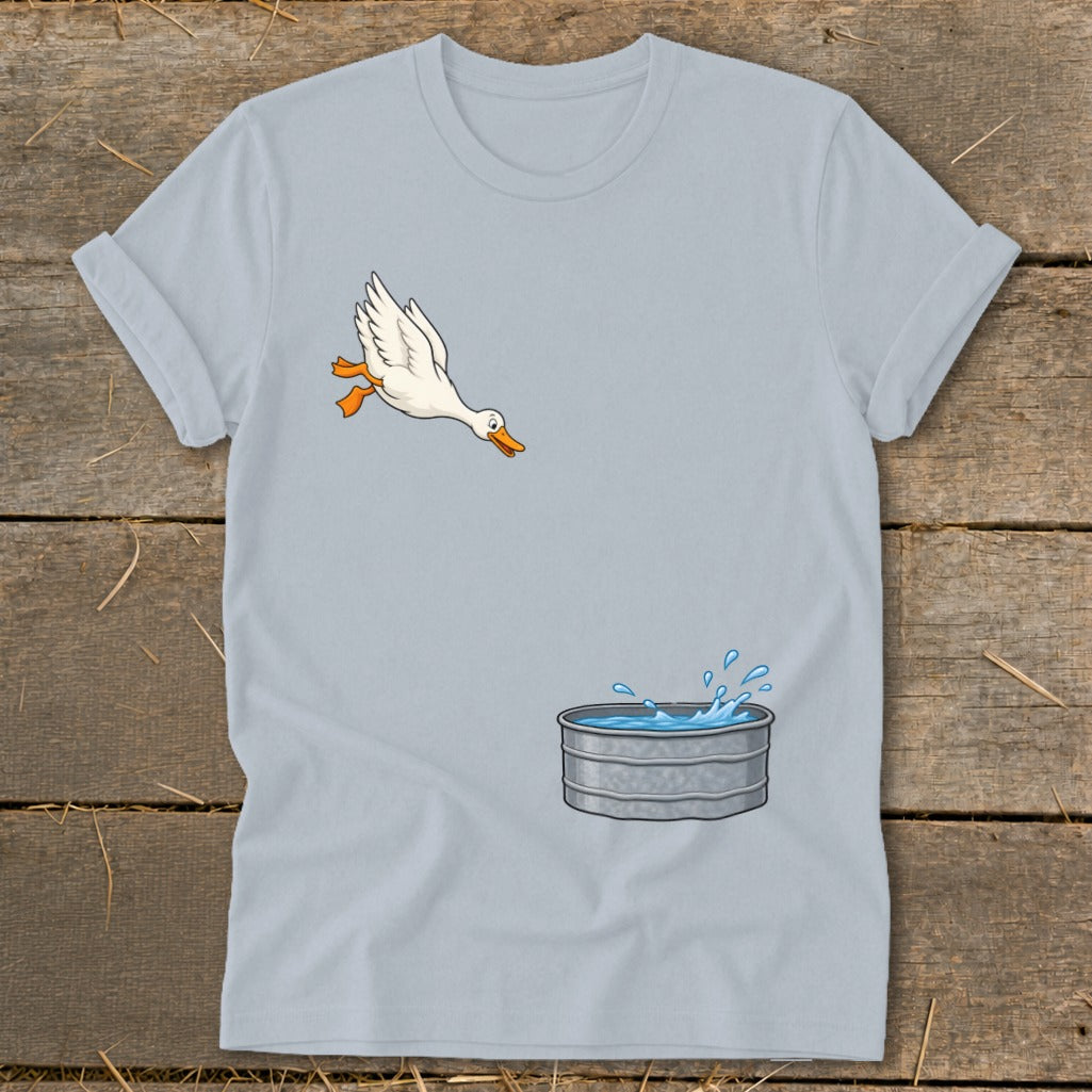 Light blue t-shirt with a cartoon duck jumping into a galvanized tub of water.