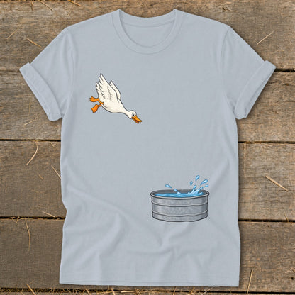 Light blue t-shirt with a cartoon duck jumping into a galvanized tub of water.