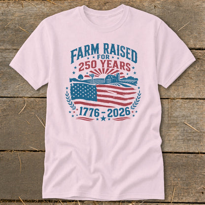 Pink t-shirt with "Farm Raised for 250 Years 1776-2026" graphic.