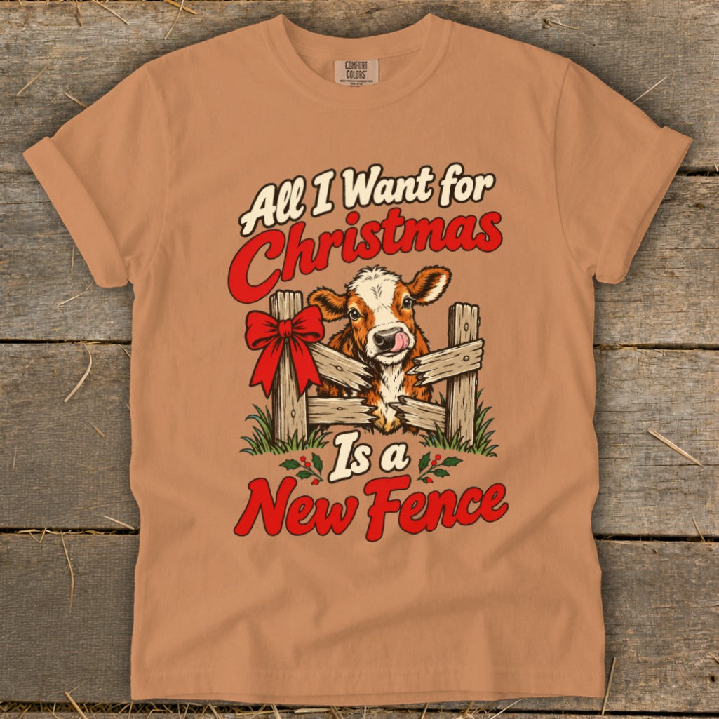 Cow licking its nose through a broken fence with text "All I Want for Christmas Is a New Fence".
