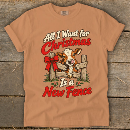 Cow licking its nose through a broken fence with text "All I Want for Christmas Is a New Fence".