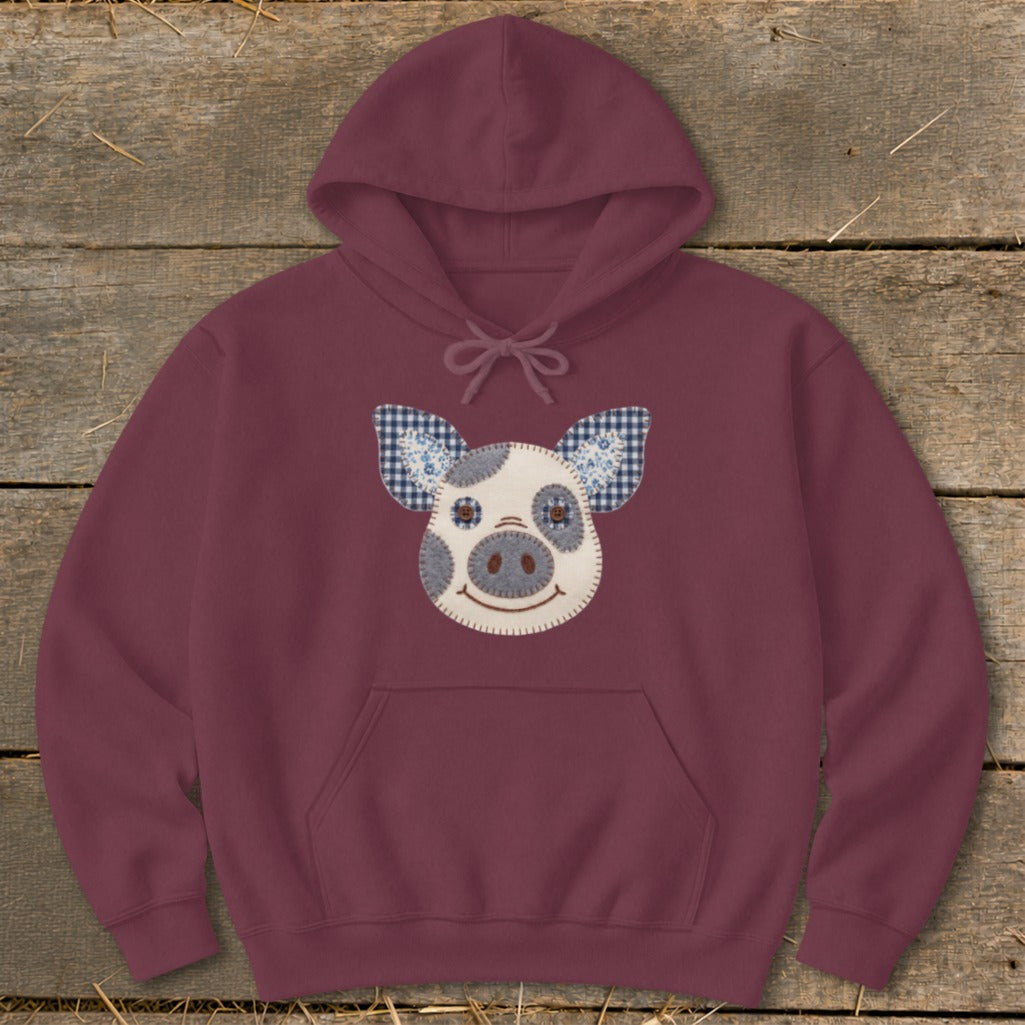 Maroon hoodie with a stitched pig face applique featuring gingham ears.
