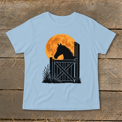 Light blue t-shirt featuring a black silhouette of a horse looking over a stable door against a large orange moon.
