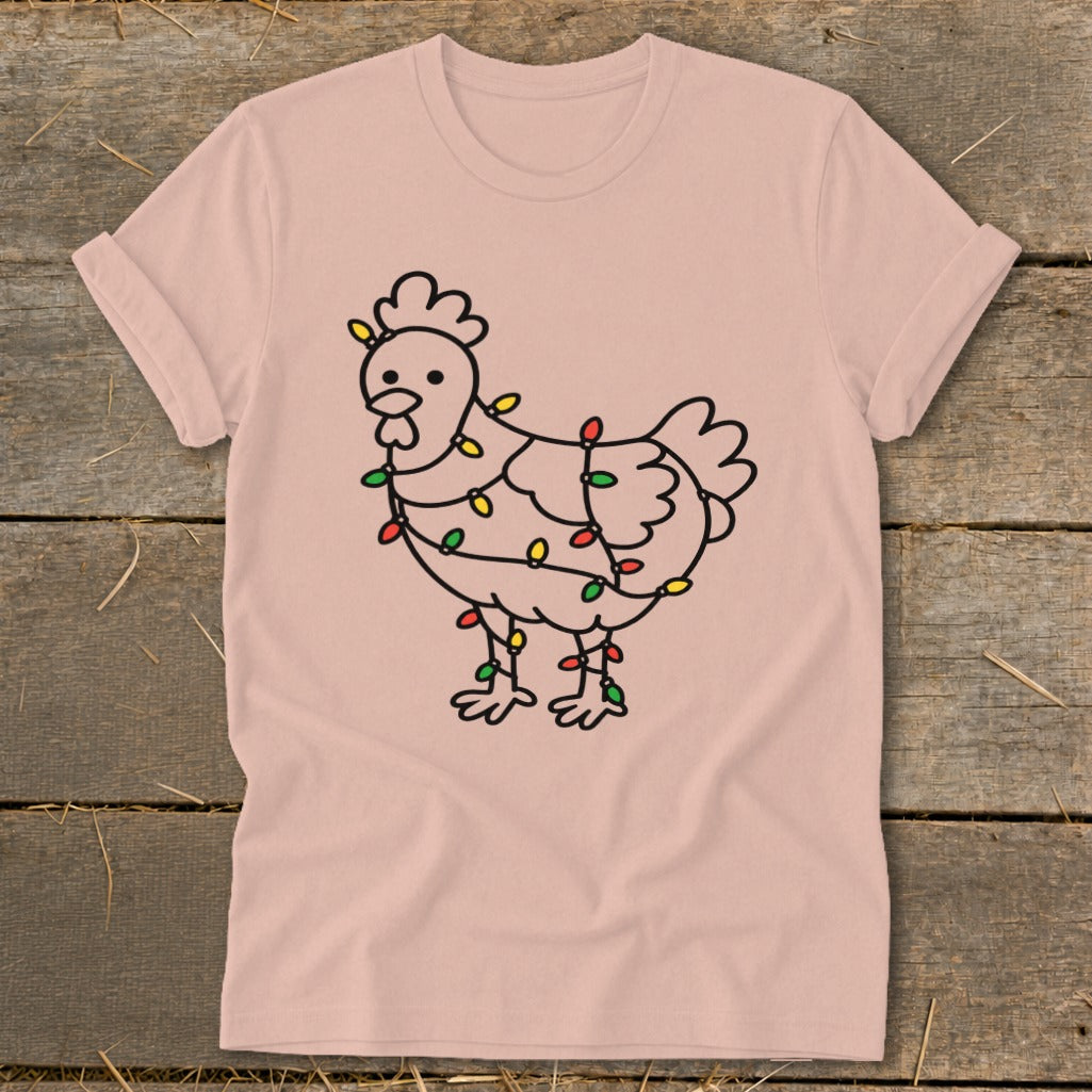 Line art chicken wrapped in colorful Christmas lights on a light pink t-shirt.