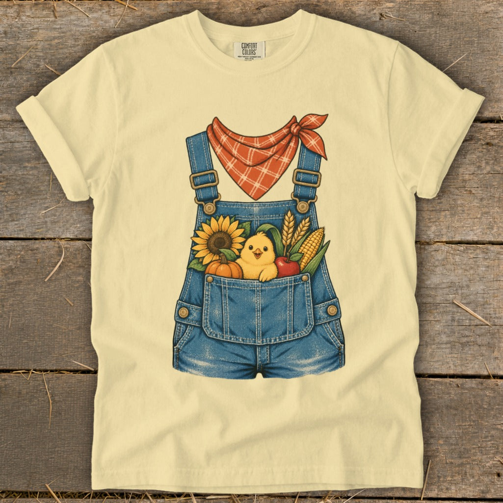 Yellow t-shirt with denim overalls graphic and farm elements.