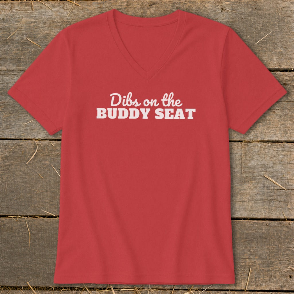 Red v-neck t-shirt with white text "Dibs on the BUDDY SEAT".