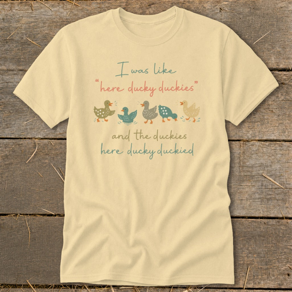 Cream t-shirt with ducks and the text "I was like 'here ducky duckies' and the duckies here ducky duckied."