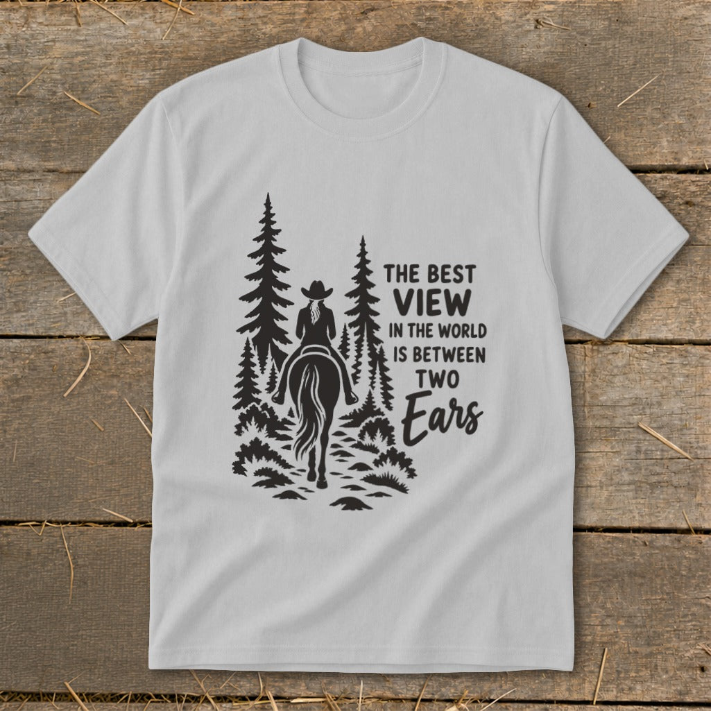 Light gray t-shirt featuring a black silhouette of a horseback rider among trees and text.