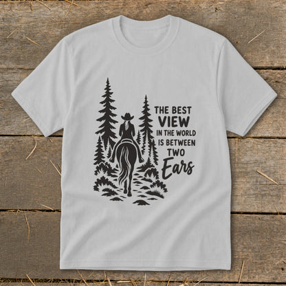 Light gray t-shirt featuring a black silhouette of a horseback rider among trees and text.
