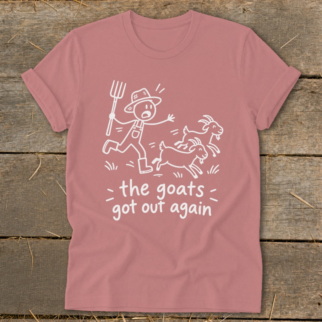 T-shirt with cartoon farmer chasing goats, text "the goats got out again".