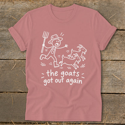 T-shirt with cartoon farmer chasing goats, text "the goats got out again".