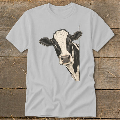 Black and white cow peeking around a corner on a grey t-shirt.