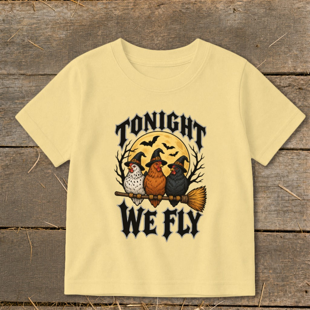 Three chickens in witch hats ride a broom with "Tonight We Fly" text.