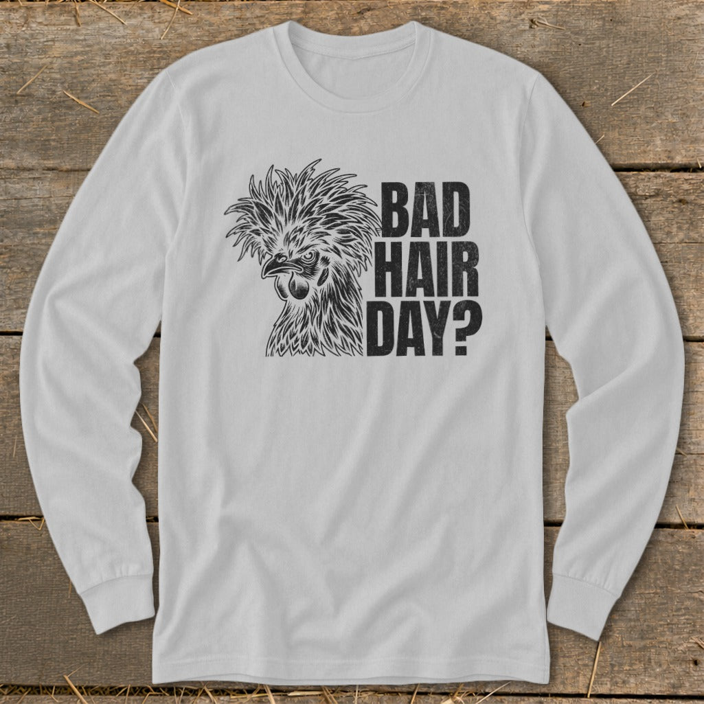 White long-sleeved shirt with a chicken graphic and text "BAD HAIR DAY?".