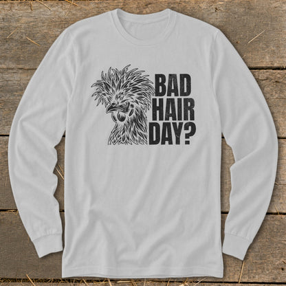 White long-sleeved shirt with a chicken graphic and text "BAD HAIR DAY?".