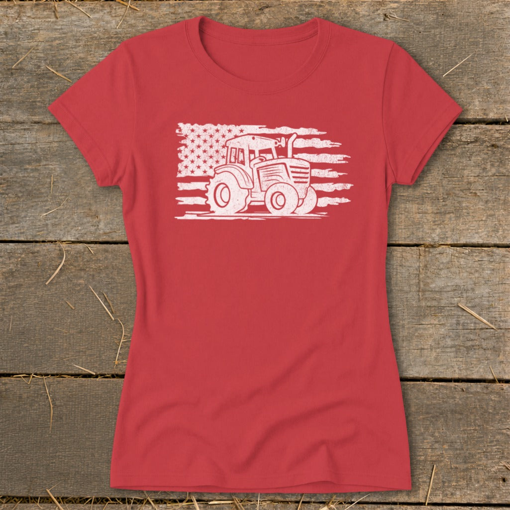 Red t-shirt with white tractor graphic superimposed on distressed American flag.