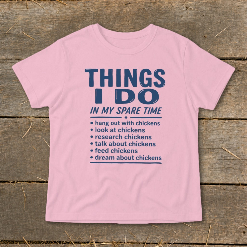 Pink t-shirt with "Things I Do In My Spare Time" and chicken-related activities.