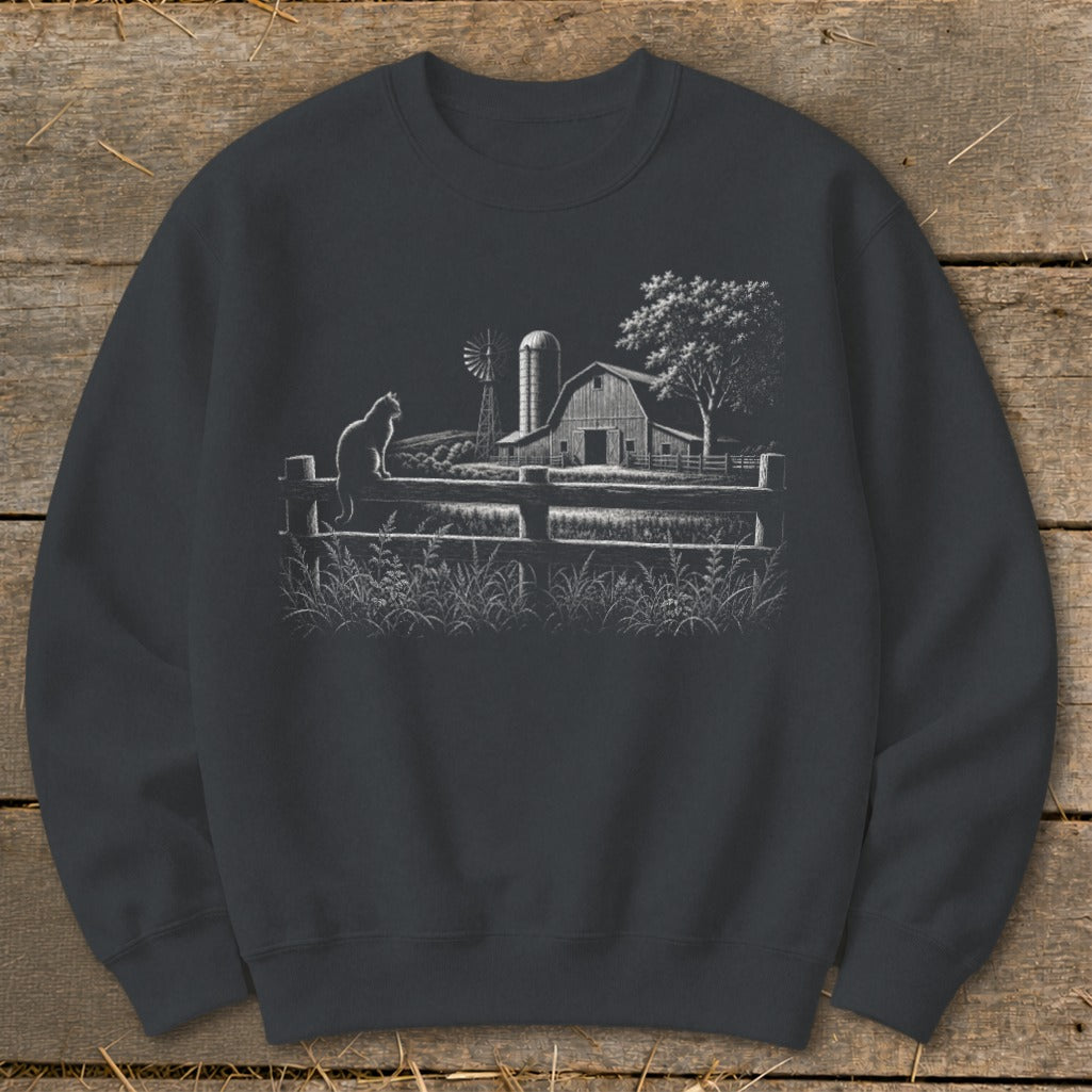 Cat sitting on fence with barn, windmill, and tree in the background.