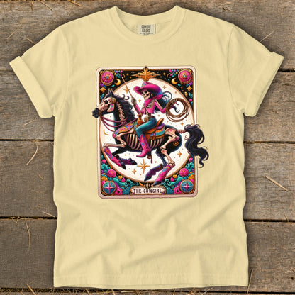 Skeleton cowgirl on horse, holding lasso, with text "THE COWGIRL".