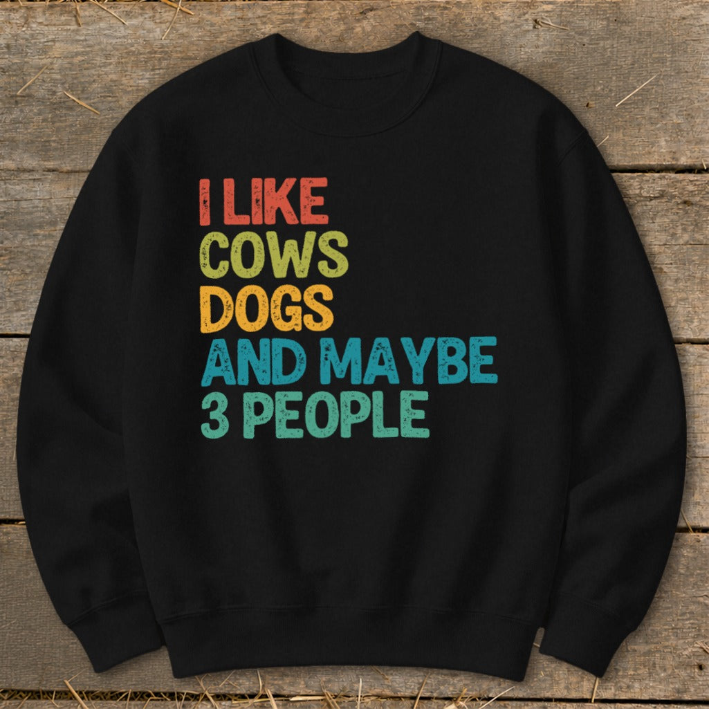 Black sweatshirt with text "I like cows dogs and maybe 3 people".
