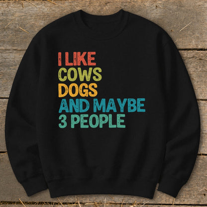 Black sweatshirt with text "I like cows dogs and maybe 3 people".