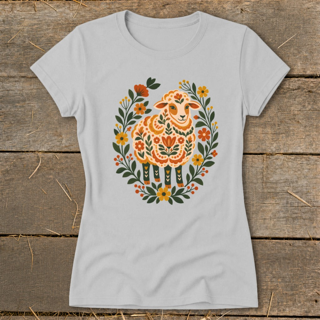 Light grey t-shirt with a folk art sheep surrounded by a floral wreath.