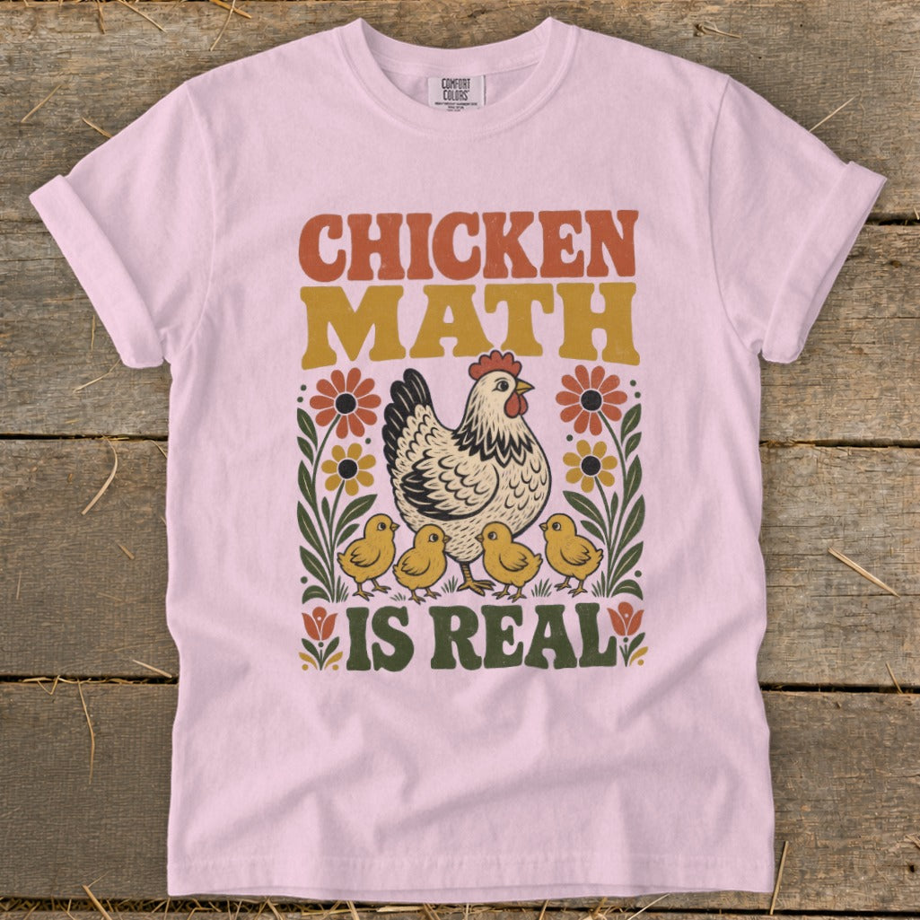 Pink t-shirt with "Chicken Math is Real" text, a hen, chicks, and flowers.