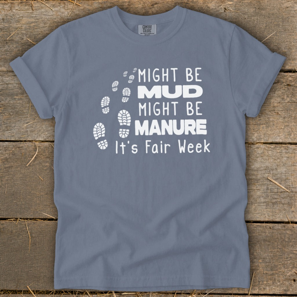Gray t-shirt with white text: "Might be Mud, Might be Manure, It's Fair Week." Footprints graphic.