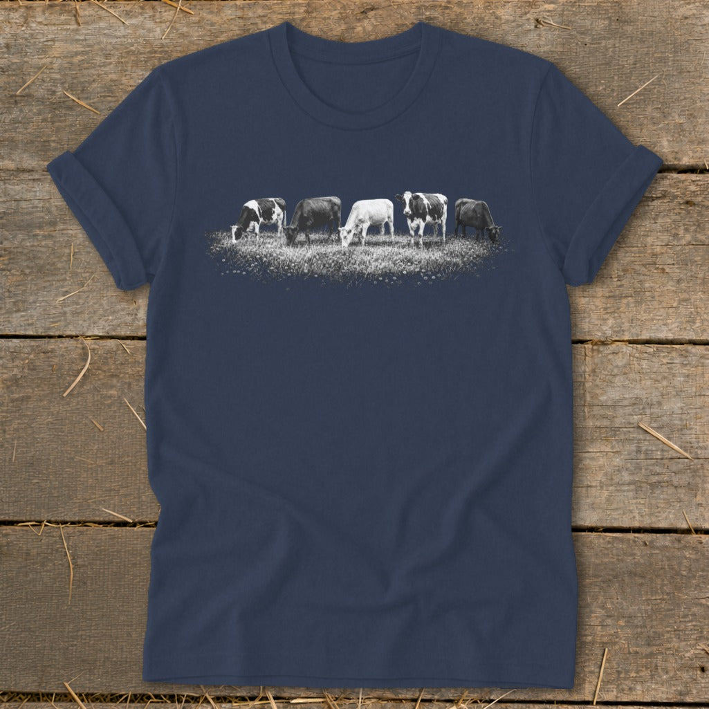 Navy t-shirt with a graphic of five cows grazing in a field.
