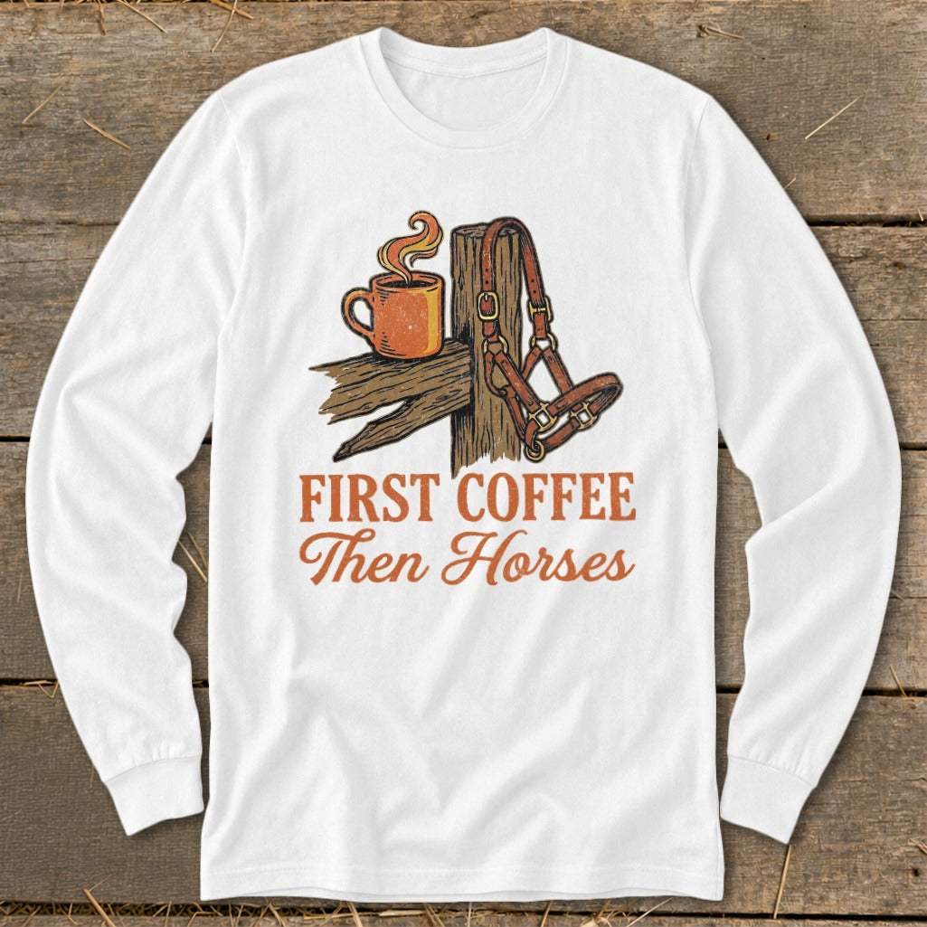 White long sleeve shirt with text "First Coffee Then Horses" and illustration.