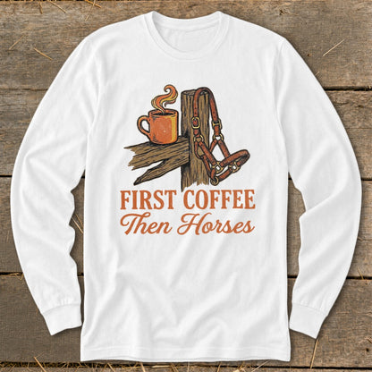 White long sleeve shirt with text "First Coffee Then Horses" and illustration.