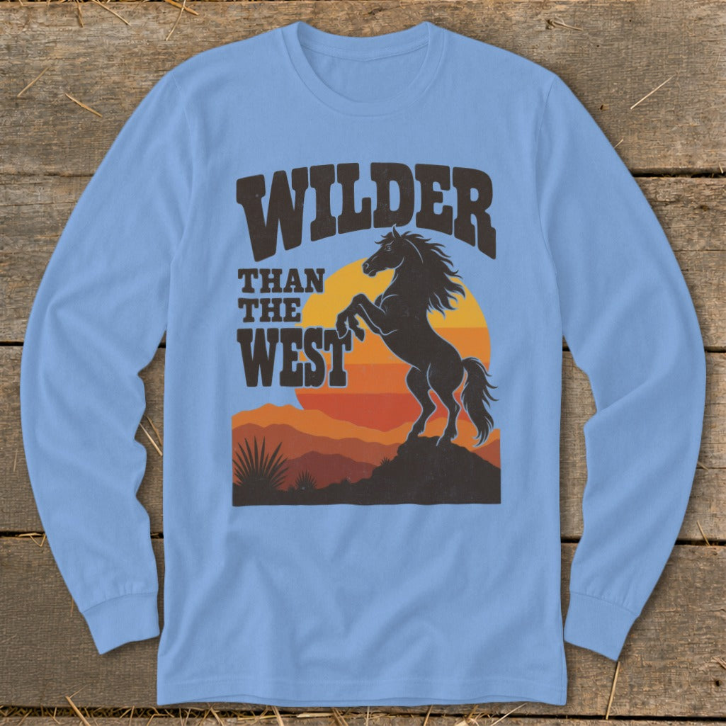Light blue long-sleeve shirt with "Wilder Than The West" text and rearing horse.