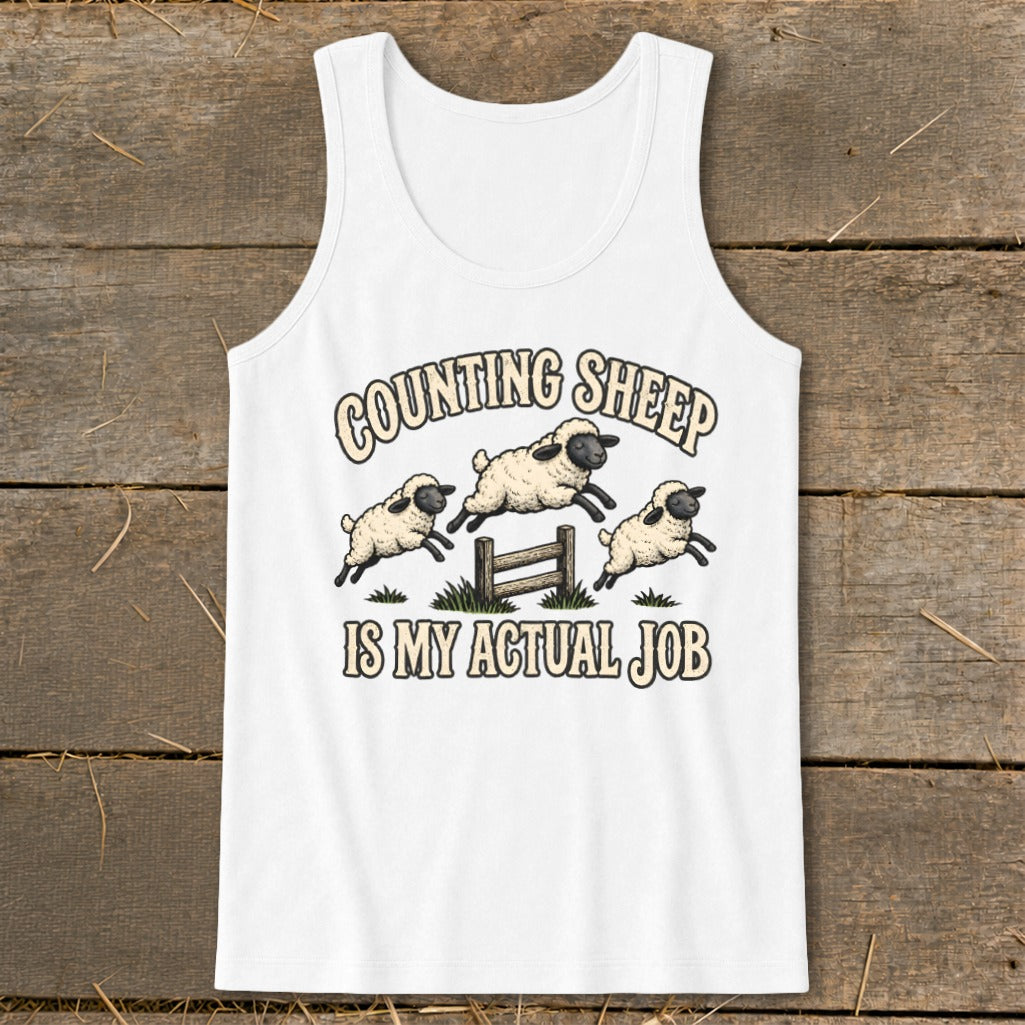 White tank top with "Counting Sheep IS MY ACTUAL JOB" text and three sheep jumping over a fence.
