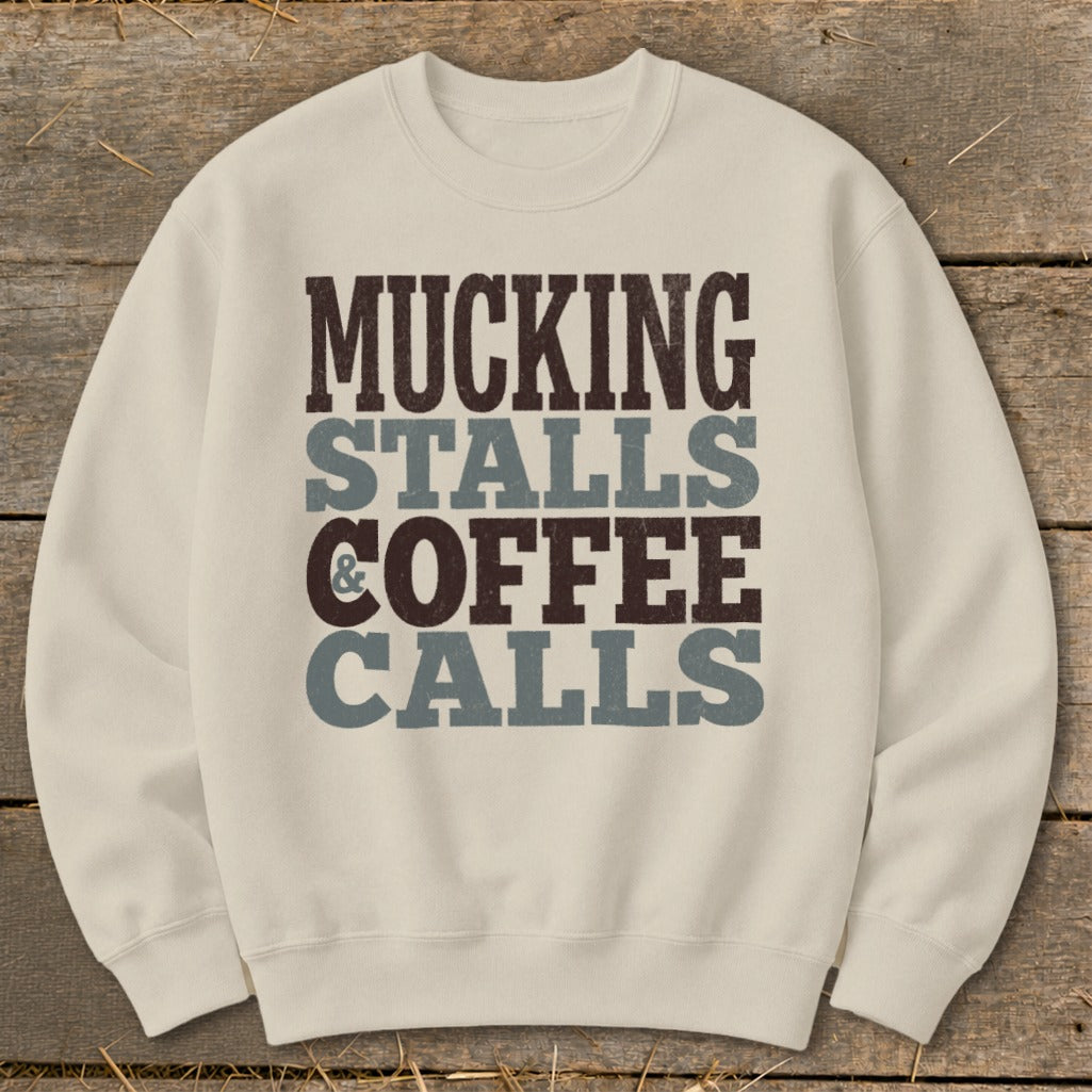 Cream sweatshirt with "MUCKING STALLS & COFFEE CALLS" text design.