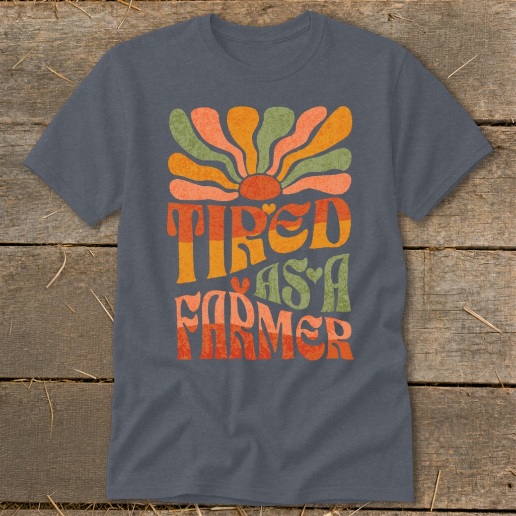 Dark grey t-shirt with retro "Tired as a Farmer" graphic.