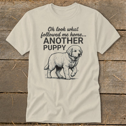 Cream t-shirt with black graphic: "Oh look what followed me home... ANOTHER PUPPY" and a drawing of a puppy.