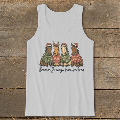 Four horses in Christmas sweaters and hats with text "Seasons Greetings from the Herd".