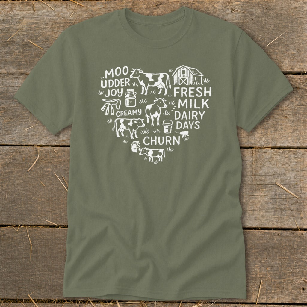 Olive t-shirt with white heart graphic featuring cows, milk jugs, and text.