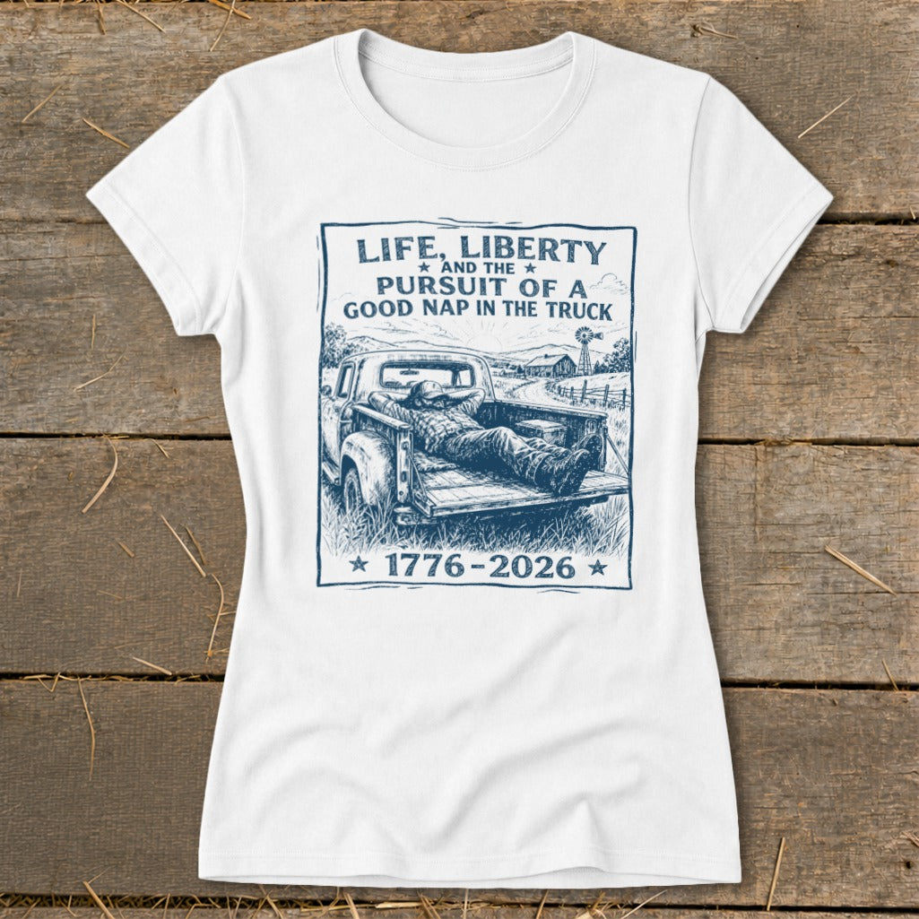 White t-shirt with graphic "Life, Liberty and the Pursuit of a Good Nap in the Truck 1776-2026".