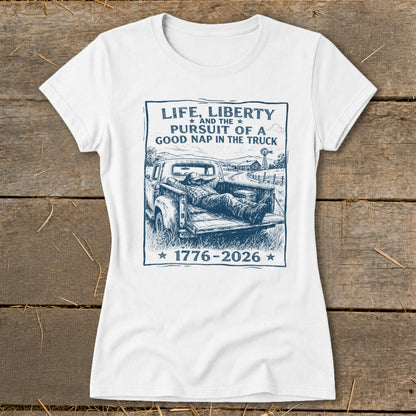 White t-shirt with graphic "Life, Liberty and the Pursuit of a Good Nap in the Truck 1776-2026".
