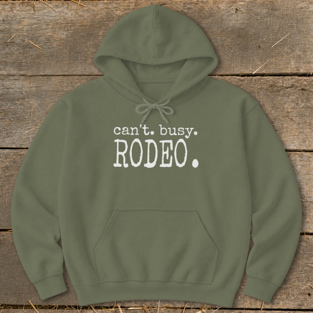 Olive green hoodie with white text "can't. busy. RODEO."