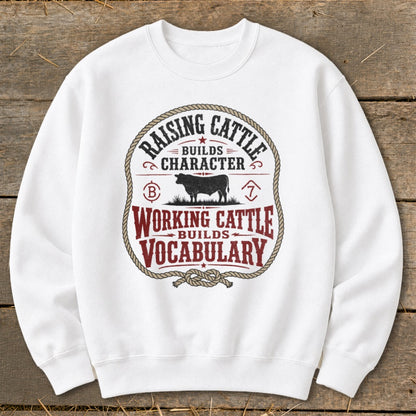 White sweatshirt with "Raising Cattle Builds Character" and "Working Cattle Builds Vocabulary" text.