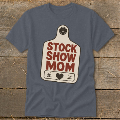 Blue t-shirt with "Stock Show Mom" text on a cow tag graphic.