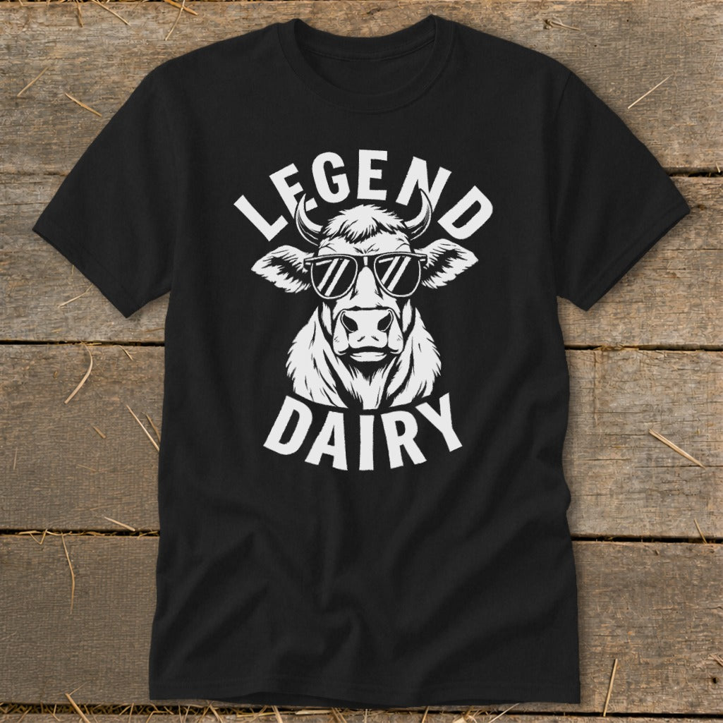 Black t-shirt with white graphic of a cow wearing sunglasses and text "LEGEND DAIRY".