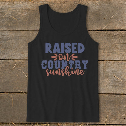 Black tank top with "RAISED ON COUNTRY SUNSHINE" text in blue and coral.