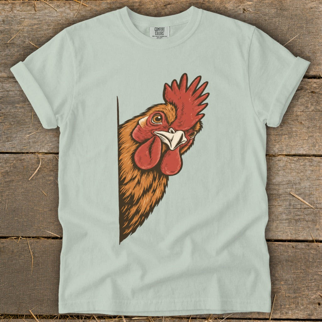 Light blue t-shirt with a graphic of a curious rooster peeking from the side.