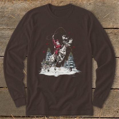 Santa rides a moose while swinging a lasso in a snowy forest.