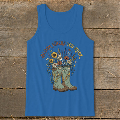 Blue tank top with "Bloom Where You Muck" text and floral boot graphic.