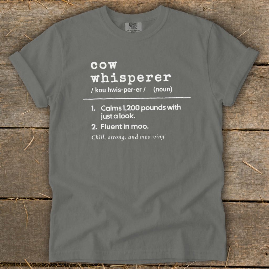 Gray t-shirt with "Cow whisperer" definition: calms 1,200 pounds, fluent in moo.