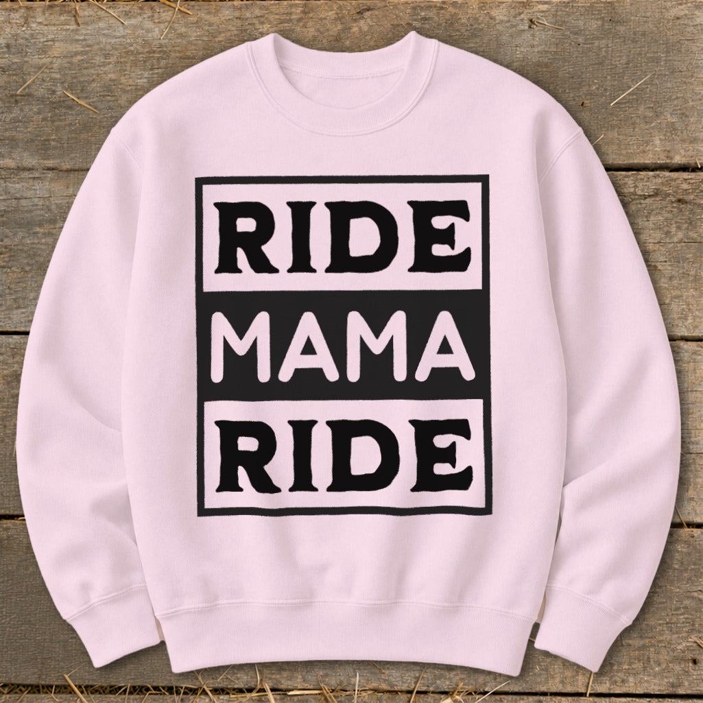 Pink crewneck sweatshirt with black text "RIDE MAMA RIDE" in a box.